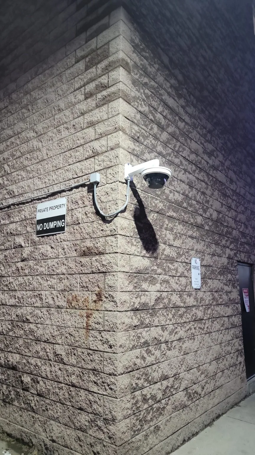 Exterior commercial CCTV camera installed on a masonry wall
