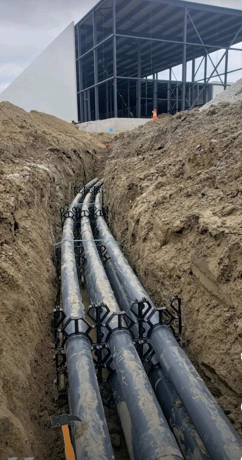 Underground electrical duct bank conduits installed in a trench