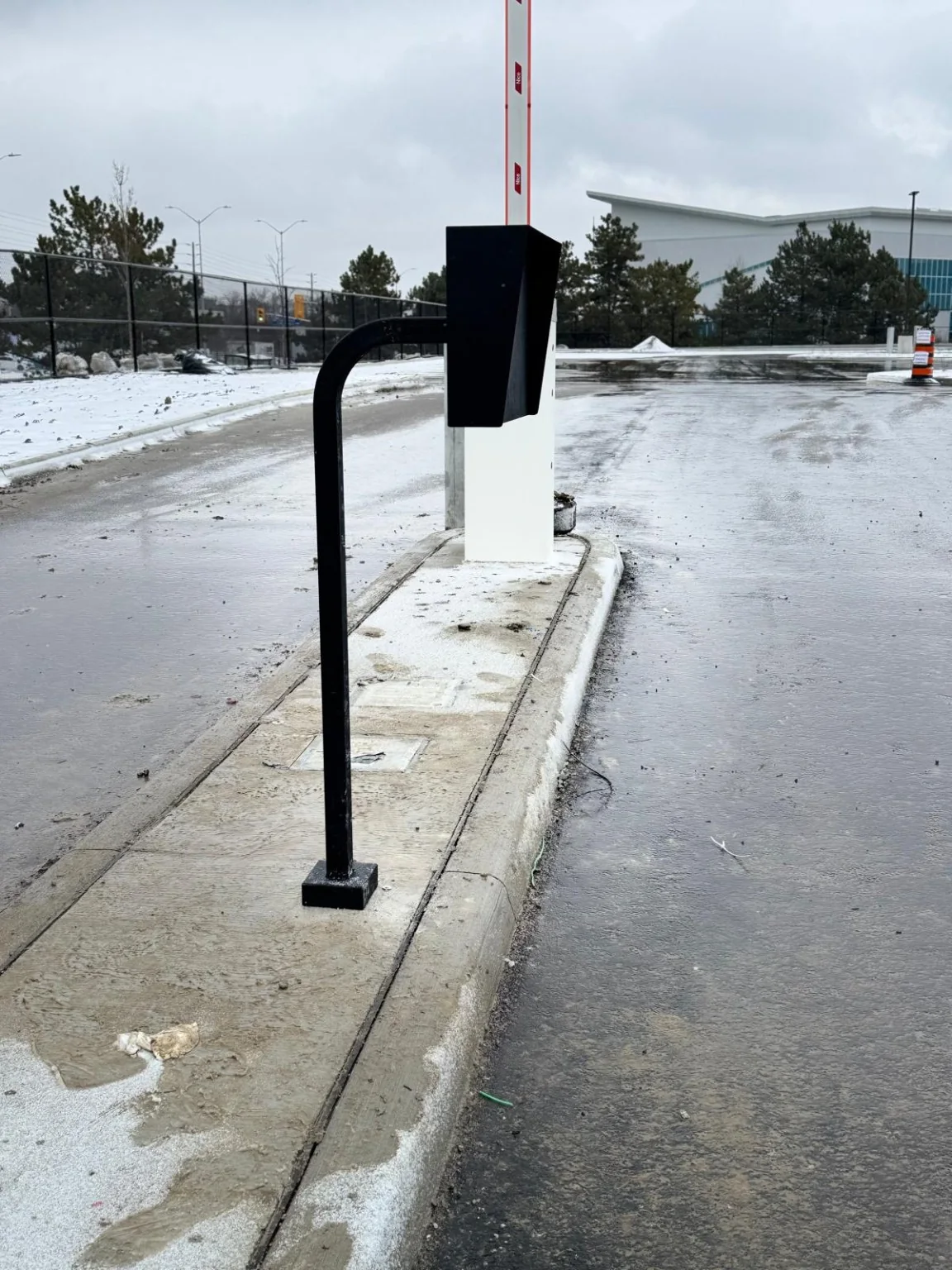 Vehicle access barrier gate and field pedestal installation at a commercial site